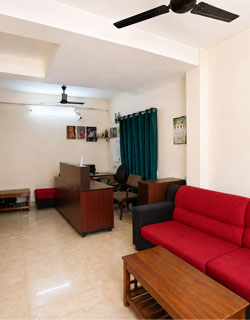 Modern reception lobby at Honey Bee Boutique Hotel in Iyyappanthangal Chennai with comfortable seating and guest services