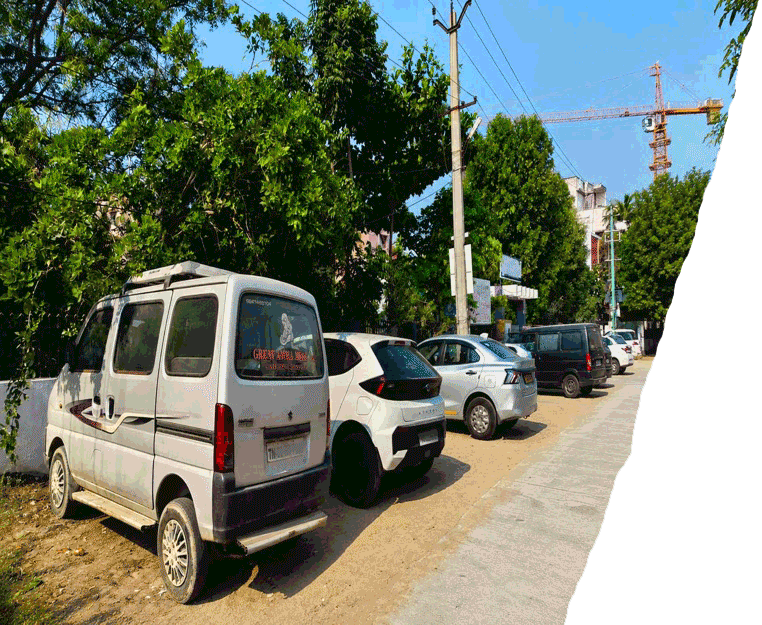 Secure parking facility at Honey Bee Boutique Hotel in Iyyappanthangal Chennai with safe vehicle parking for guests